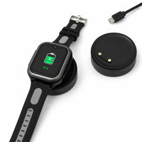 Lil Tracker GPS watch charging on portable magnetic charging dock