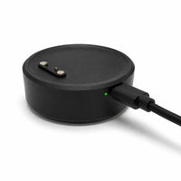 Portable Lil Tracker charging dock plugged in with green indicator light